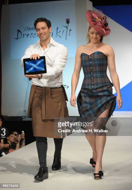 Eric Villency walks the runway with the iPad at the 8th annual "Dressed To Kilt" Charity Fashion Show presented by Glenfiddich at M2 Ultra Lounge on...