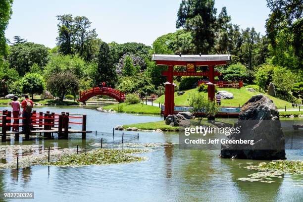 Argentina, Buenos Aires, Recoleta, Japanese Garden, Carp Lake, red bridge and Torii gate.