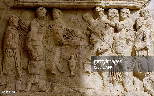 Picture taken on March 30, 2010 shows a detail of the pediment of the Arch of Septimus Severus at the historical site of Leptis Magna, listed as...