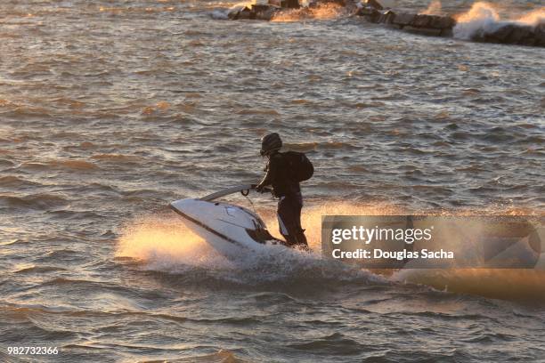 stand up aquqtic jet ski rider on the water - jet ski ストックフォトと画像