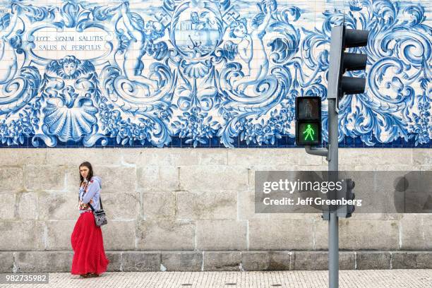 Portugal, Porto, historic district, Igreja do Carmo, church exterior mosaic wall with woman.