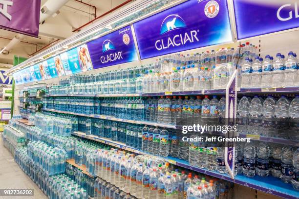 Bottles of water for sale in Supermercados Coto.