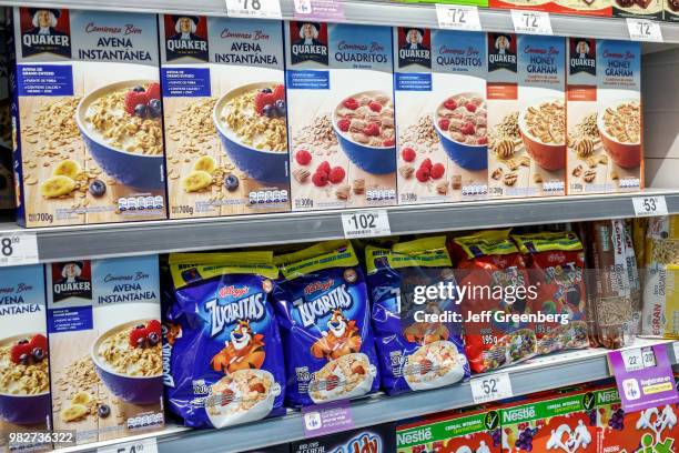 Shelves of cereals for sale inside Carrefour Express.