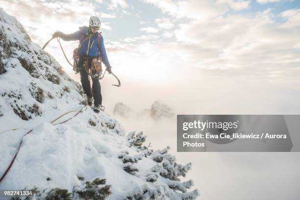 mountain climber in winter in tatra mountains, malopolskie province, poland - tatra stockfoto's en -beelden