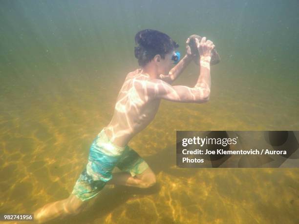 491 Man Carrying A Rock Stock Photos, High-Res Pictures, and Images ...
