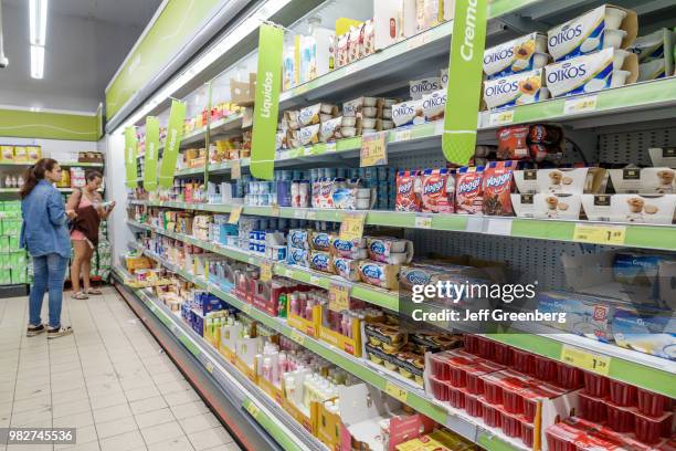 Portugal, Coimbra, Mini Preco, supermarket yogurt display case.