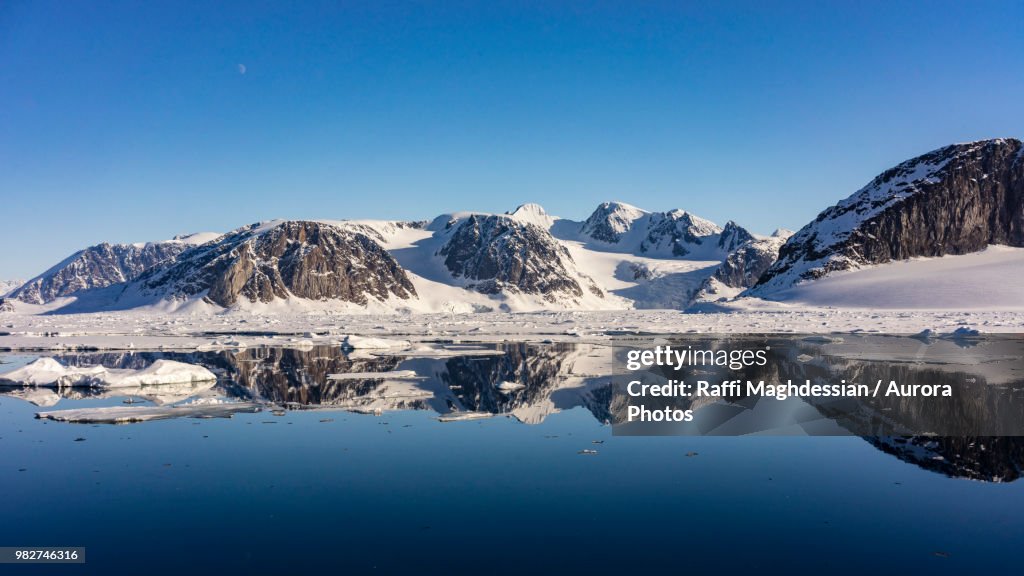 Arctic scenery with snow covered mountains and sea, Spitsbergen, Svalbard and Jan Mayen, Norway