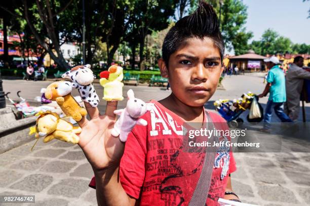 Jardin Plaza Hidalgo, public park, street peddler, finger puppets.