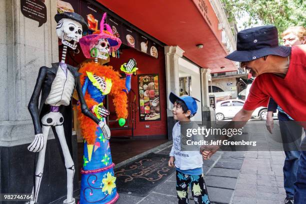 Mexico City, Jardin Centenario, La Catrina Ice Cream and Coffee, Day of the Dead couple.