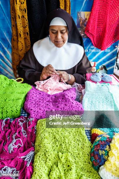 Mexico City, Saint John the Baptist Church, nun selling handicrafts in convent shop.