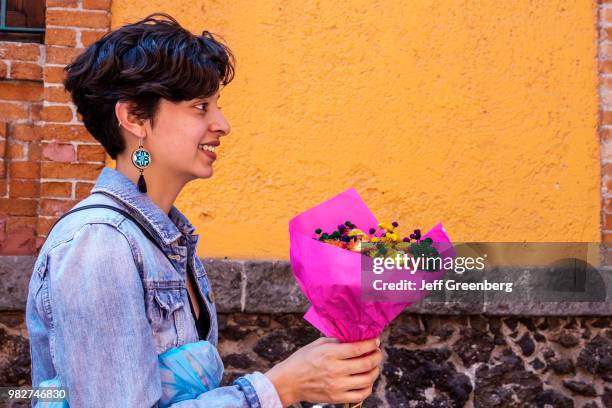 Mexico City, National Museum of Popular Culture, woman with flowers.