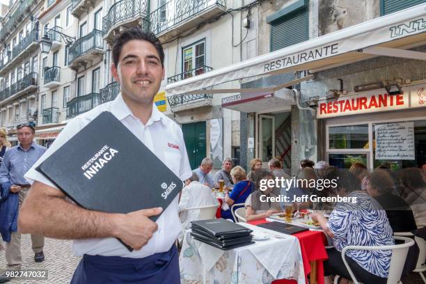 Portugal, Lisbon, Rossio, historic district, Restaurante Inhaca, waiter promoting business.