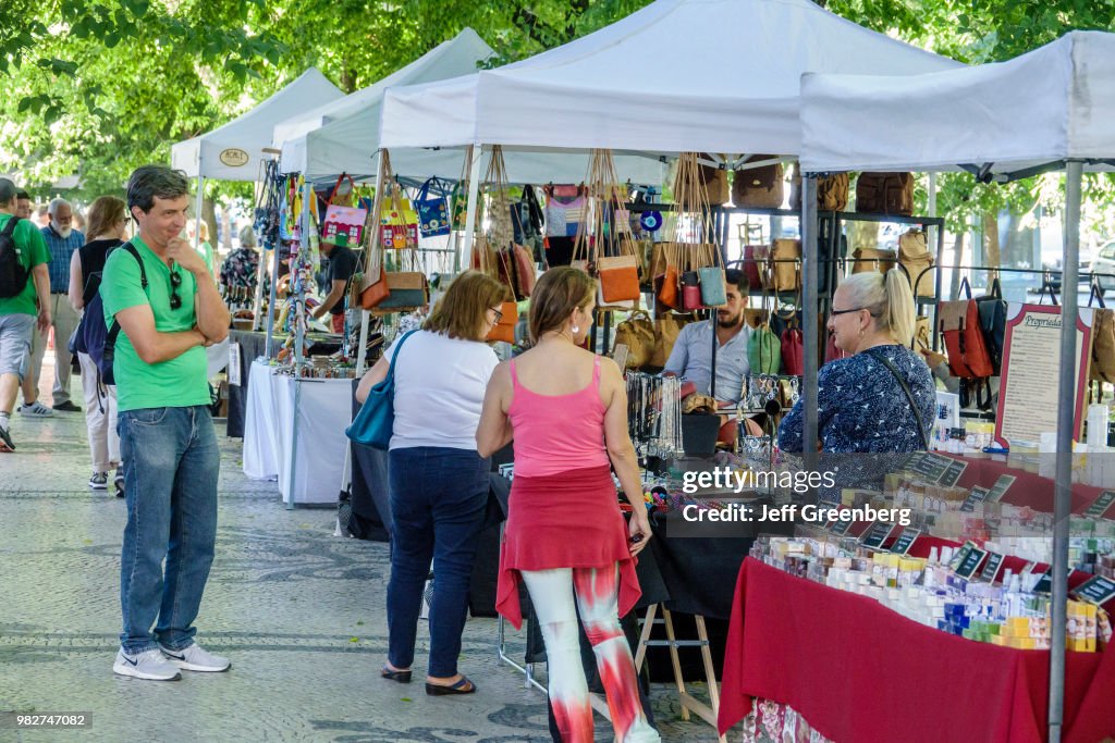 Portugal, Lisbon, Avenida Da Liberdade, Sunday flea market vendors and shoppers