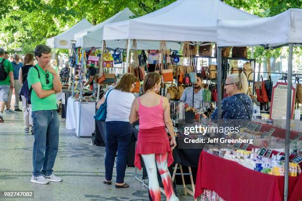 Portugal, Lisbon, Avenida Da Liberdade, Sunday flea market vendors and shoppers.