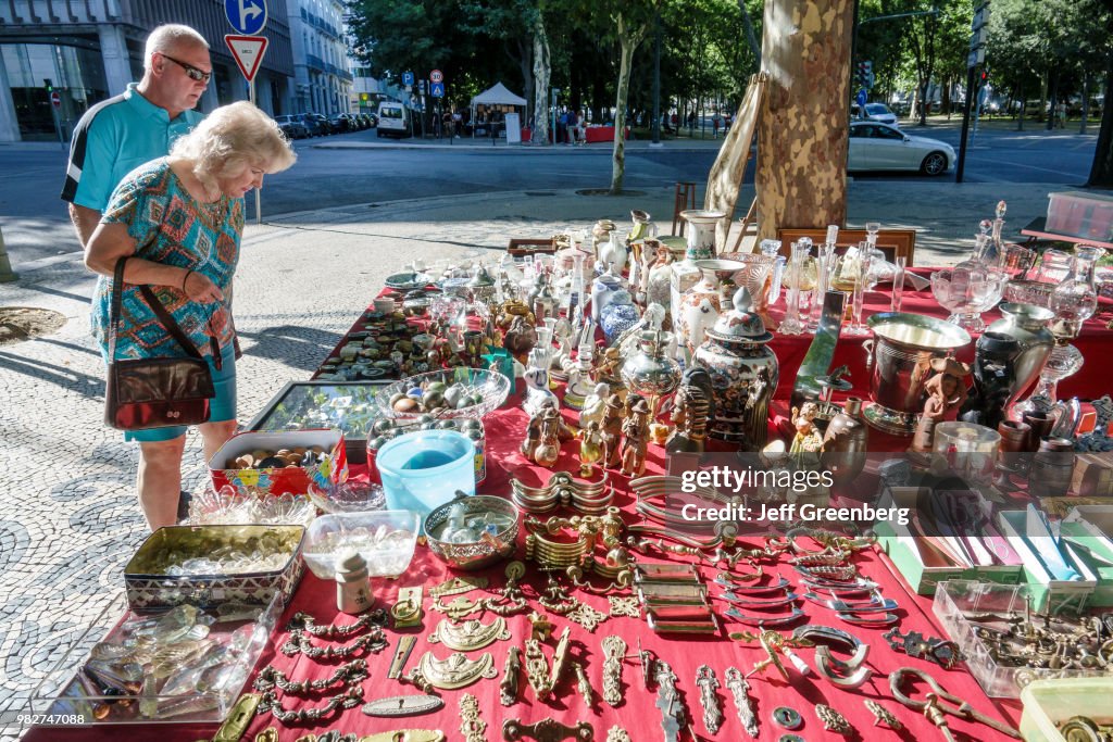 Portugal, Lisbon, Avenida Da Liberdade, Antiques Fair vendor and shoppers