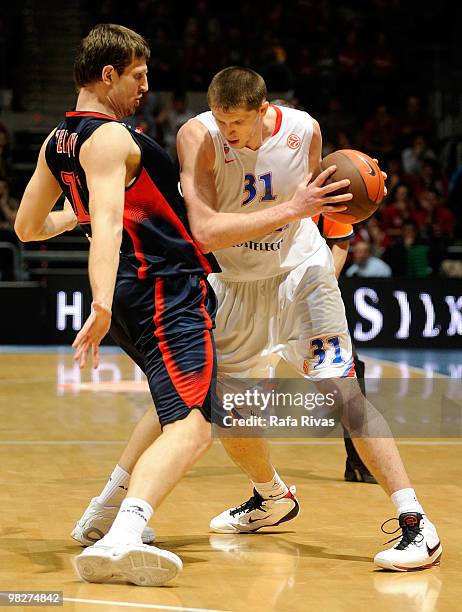 Viktor Khryapa, #31 of CSKA Moscow competes with Mirza Teletovic, #12 of Caja Laboral during the Euroleague Basketball 2009-2010 Play Off Game 4...