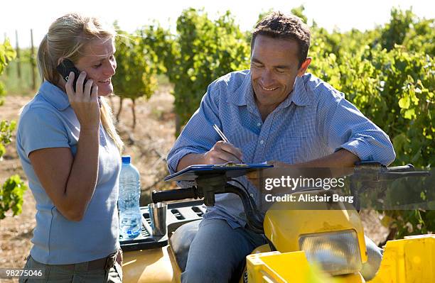 male and female farmers in vineyard - newbusiness stock pictures, royalty-free photos & images