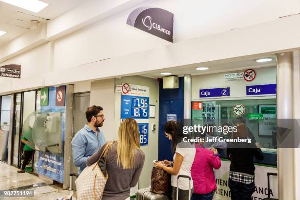 Mexico City, Airport CIBanco, currency exchange agency and tourists.