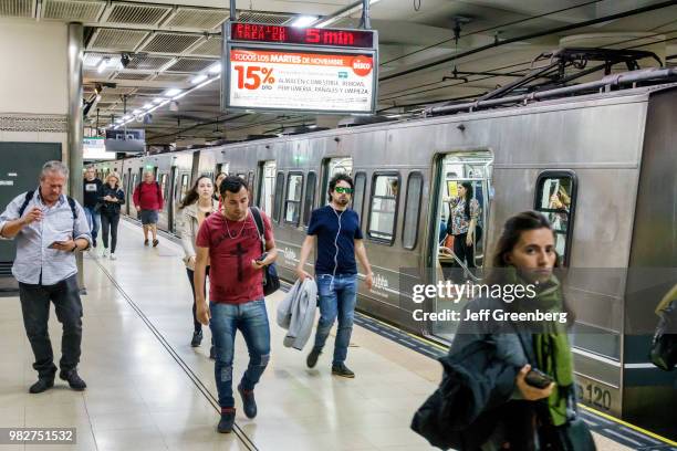 Argentina, Buenos Aires, Line D, Juramento subway station, platform with incoming train.