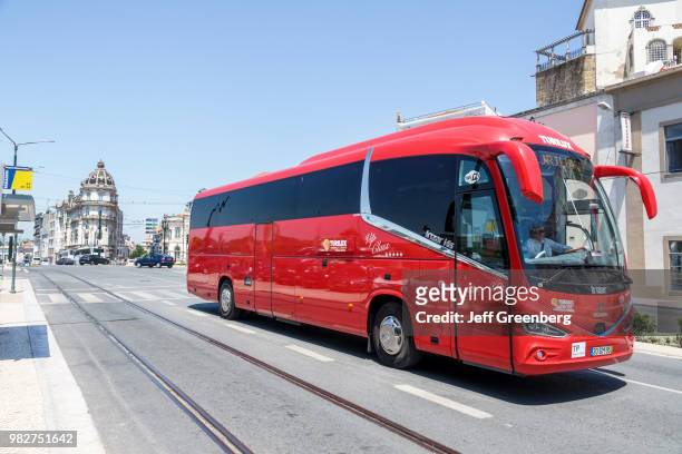 Portugal, Coimbra, TuPortuguese, red sightseeing tour bus.
