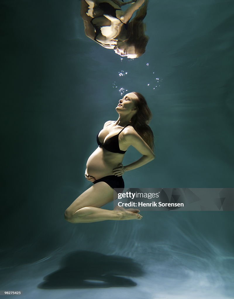 Pregnant woman underwater