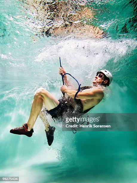 adult male abseiler underwater - henrik sorensen stock-fotos und bilder