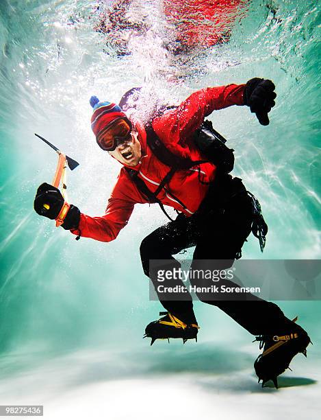 mountain climber underwater - icepick stock-fotos und bilder