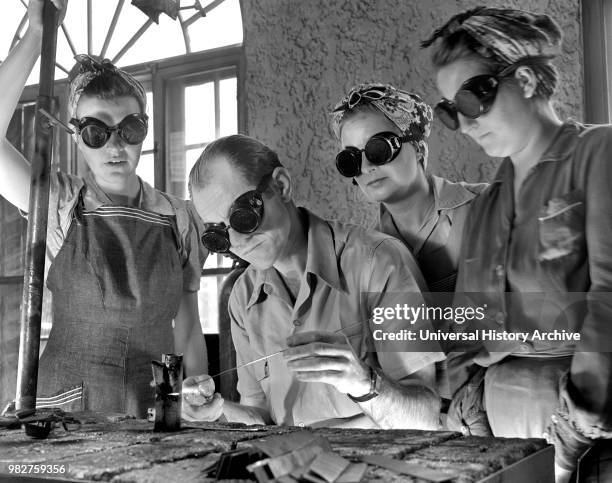 Instructor Training Three Women to Weld Aircraft at Vocational School as part of Program to Provide more Workers for War Production for Florida's...