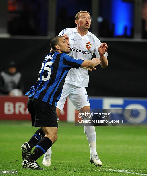 Walter Samuel of FC Internazionale Milano battles to thake the right place against Vasili Berezutski of CSKA Moscow during the UEFA Champions League...