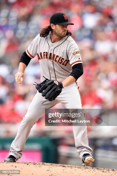 Cory Gearrin of the San Francisco Giants pitches during a baseball game against the Washington Nationals at Nationals Park on June 20, 2018 in...