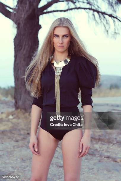 young woman in black bodysuit looking at camera, athens, greece - chitwa stock pictures, royalty-free photos & images