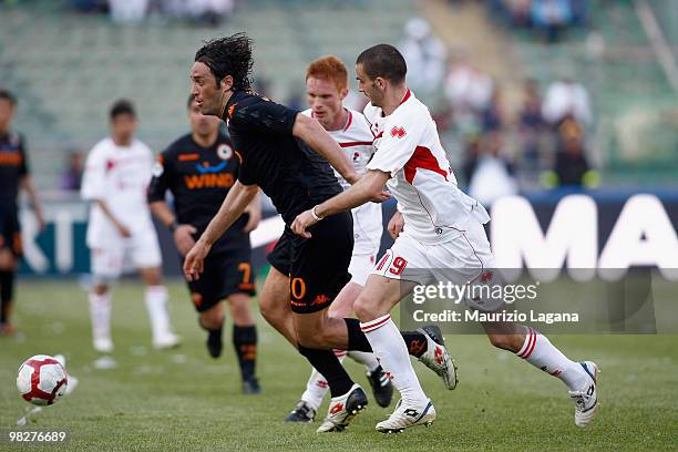 Leonardo Bonucci of AS Bari battles for the ball with Luca Toni of AS Roma during the Serie A match between AS Bari and AS Roma at Stadio San Nicola...