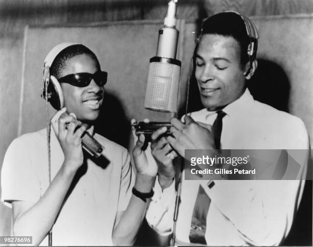 Stevie Wonder and Marvin Gaye around a microphone at the Motown recording studio in Detroit in 1965 in the United States.