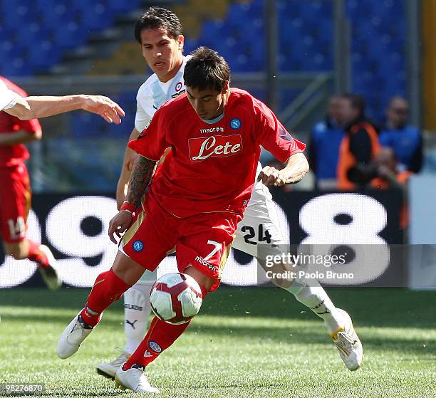 Cristian Ledesma of SS Lazio and Ivan Ezequiel Lavezzi of SSC Napoli compete for the ball during the Serie A match between SS Lazio and SSC Napoli at...