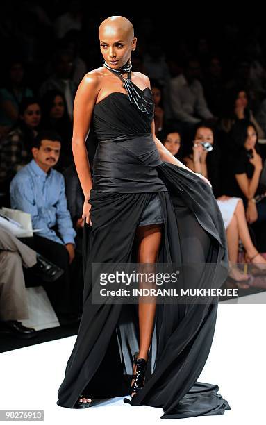 An Indian model showcases a creation by design house Vizyon on the first day of Lakme Fashion Week Summer/Resort 2010 in Mumbai on March 5, 2010. The...