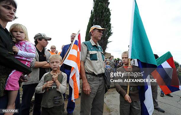 South African family supporting white supremacist Afrikaner Resistance Movement leader Eugene Terre'Blanche hold AWB flags on April 6, 2010 outside a...