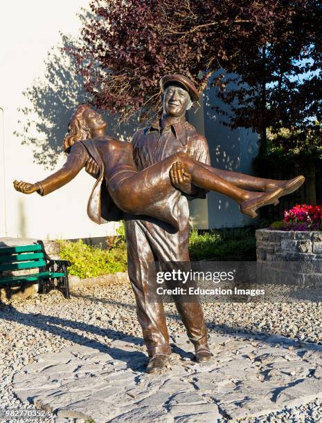 The Quiet Man statue, Cong, County Mayo, Connemara, Republic of Ireland. Eire. The statue is based on the theatrical release poster for the film and...