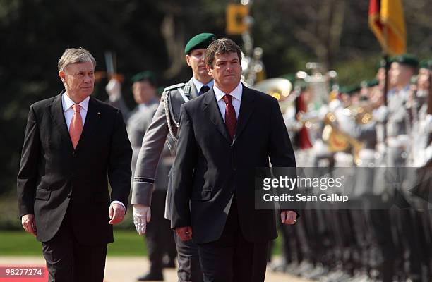 German President Horst Koehler and Albanian President Bamir Topi review a guard of honour upon Topi's arrival at Bellevue Palace on April 6, 2010 in...