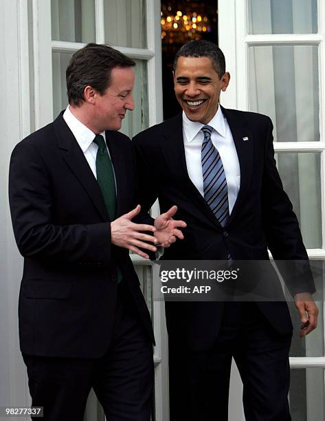 President Barack Obama talks with opposition Conservative party leader David Cameron at Winfield House, the US Ambassadors residence in Regent's Park...