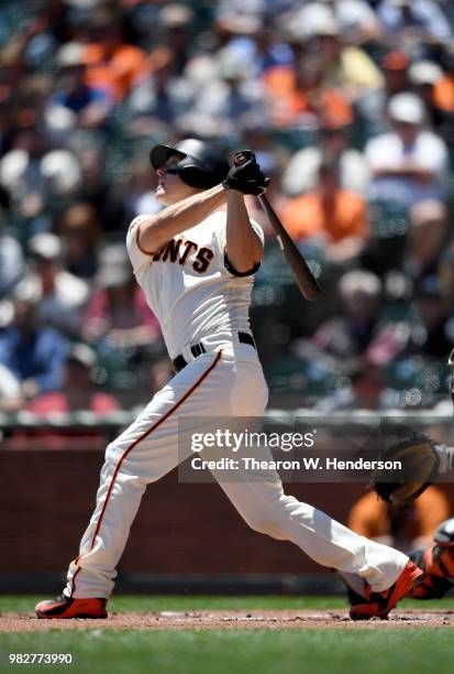 Nick Hundley of the San Francisco Giants bats against the Miami Marlins in the bottom of the first inning at AT&T Park on June 20, 2018 in San...