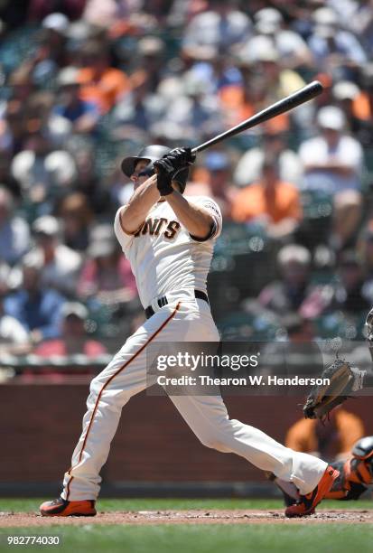 Nick Hundley of the San Francisco Giants bats against the Miami Marlins in the bottom of the first inning at AT&T Park on June 20, 2018 in San...