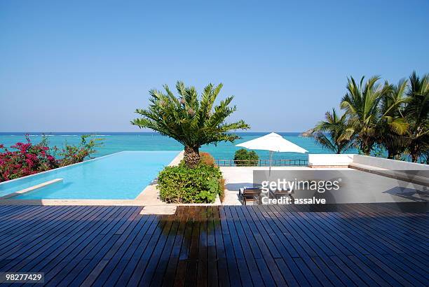 luxury seaside apartment - beach deck chairs stock pictures, royalty-free photos & images