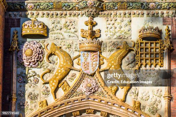 Elaborate carving of coat of arms on St John's College Main Gatehouse. Trinity street, Cambridge university, Cambridgeshire, England, UK.