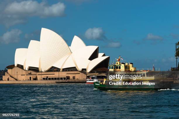 Ferry goes past the Sydney Opera House. Sydney, NSW, Australia.