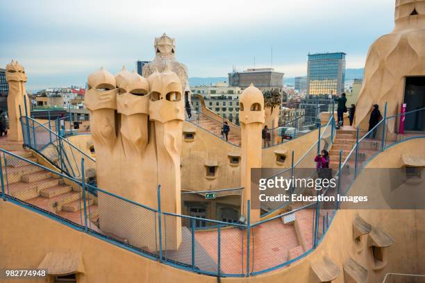 Barcelona, Guadi's The Pedrera on the roof with its unusual chimneys, Catalonia, Spain.