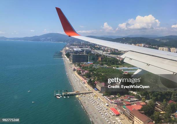 Passenger jet of Aeroflot Airlines on arrival at Sochi International Airport with aerial view on Adler beach on June 21, 2018 in Adler, Sochi, Russia.