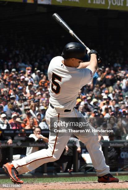 Nick Hundley of the San Francisco Giants bats against the Miami Marlins in the bottom of the six inning at AT&T Park on June 20, 2018 in San...