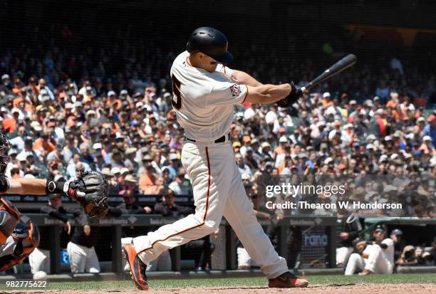 Nick Hundley of the San Francisco Giants bats against the Miami Marlins in the bottom of the six inning at AT&T Park on June 20, 2018 in San...