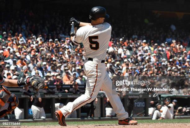 Nick Hundley of the San Francisco Giants bats against the Miami Marlins in the bottom of the six inning at AT&T Park on June 20, 2018 in San...