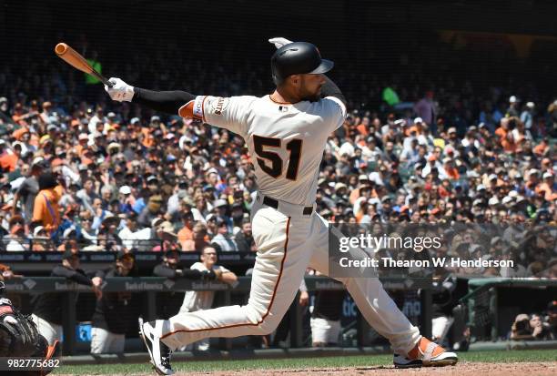 Mac Williamson of the San Francisco Giants bats against the Miami Marlins in the bottom of the six inning at AT&T Park on June 20, 2018 in San...